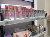a lot of makeup products on the shelves in the store