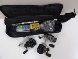 a bag with a fishing rod, reels, and other items in it