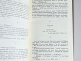 an open book with a page in it on a table