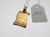 a gold plated necklace with a small piece of paper attached to it