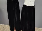 two mannequins with black velvet skirts and a white top