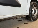 a white truck that is parked on the side of the road