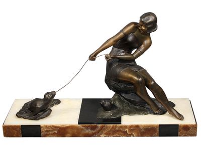 bronze statue of a woman with a dog on a marble base