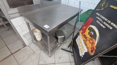 a table that is sitting in the middle of a kitchen