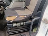 a seat in the back of a truck that has been vandalized
