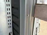 a close up of a metal door on a horse trailer