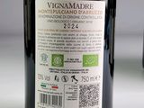 a bottle of wine sitting on a table with a label on it