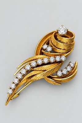 an image of a gold and diamond broochle
