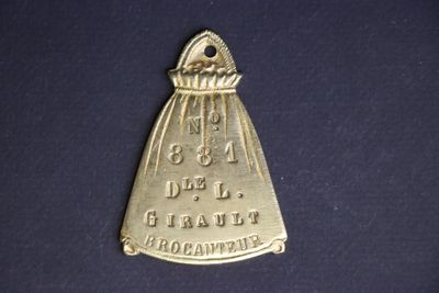 a close up of a gold medal on a black surface