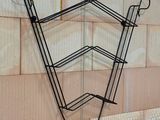 a picture of a wall mounted rack with hooks on it