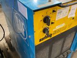 a close up of a machine with a hose on top of it