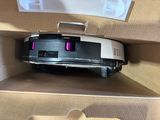 a box with a vacuum cleaner inside of it