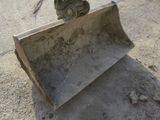 a cat that is sitting on top of a bulldozer