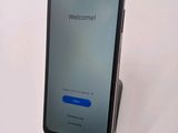 an image of a cell phone with a welcome screen on the screen