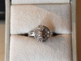 a ring that is sitting in a box on a table