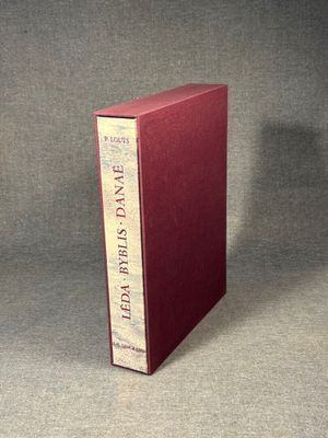 the book is sitting on a table with a gray background