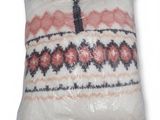 the pillow is wrapped in plastic and ready to be used
