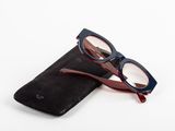 a pair of glasses sitting on top of a black case