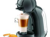 une image d'une machine à café avec une tasse de café à côté d'elle