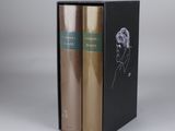 two books in a black box with a drawing of a man ' s face