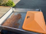 an orange box sitting in the back of a truck