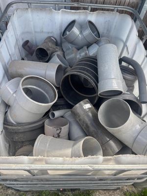 a basket full of different types of pipes and fittings