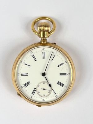 a gold pocket watch with roman numerals on the face