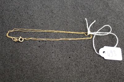 a gold chain with a tag attached to it