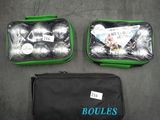 two bags of golf balls and a bag of golf balls on a table