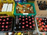 many boxes of sodas and soda bottles on the table