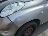 a car that has been badly damaged and is parked in a parking lot