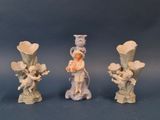 three figurines that are sitting on a table