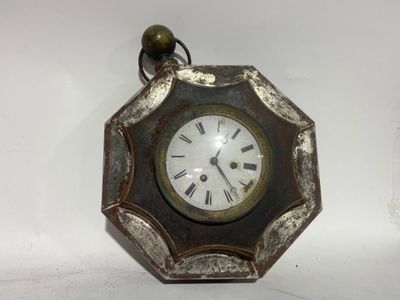 a clock that is hanging on the wall in the room