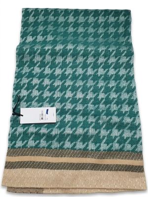 a teal and brown hounds checkered blanket with a tag on it