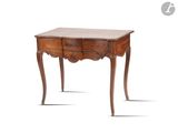 an old wooden table with two drawers and a drawer underneath it
