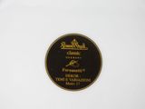 a close up of a white plate with a black label on it