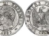 a silver coin with an eagle on the front and a head on the back