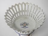 a white bowl with a blue and white design on it
