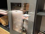 a microwave with a glass door in a kitchen