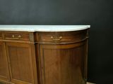 an image of a wooden sideboard with marble top on a wooden floor