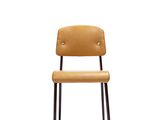 the chair is made of wood and has a leather seat