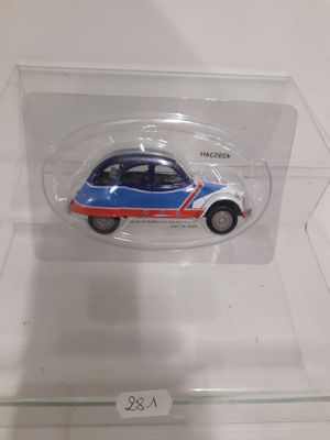 a small toy car that is in a clear box