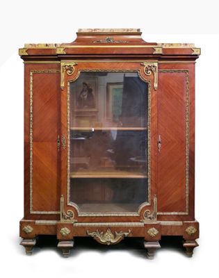 a wooden cabinet with a glass door on top of it