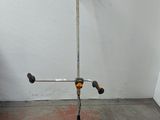 a scooter that is leaning against a wall