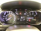 a close up of a car dashboard with a speedometer and gauges