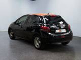 an image of a black and orange car parked in a garage