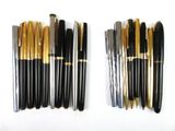 several different types of pens lined up on top of each other