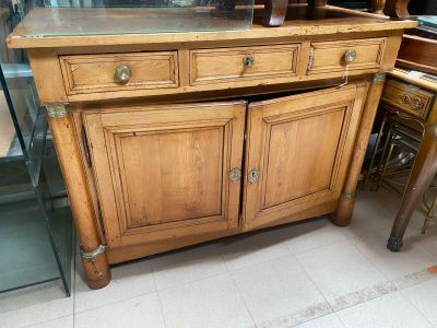a wooden cabinet with a glass top in a room