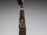 an image of a statue of a woman with a bird on her head