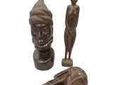 wooden figurines of a man and a woman with a hammer